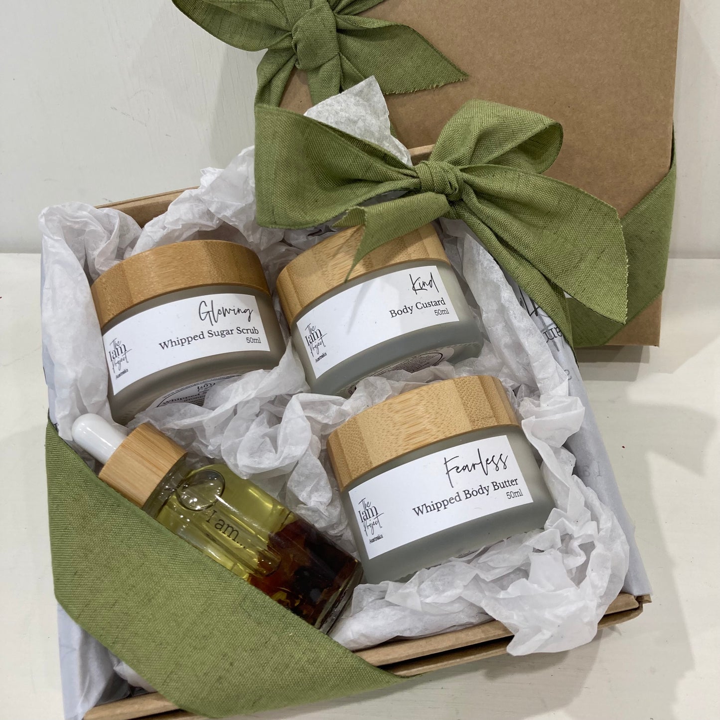 A curated collection of 50ml sugar scrub, 50ml body custard, 50ml whipped body butter, and 30ml bath and body oil for a spa-like skincare experience at home.