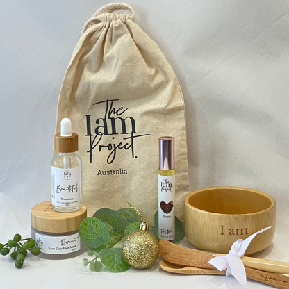 Collection of 'The I am Project Australia' products including bottles, a bowl, and a drawstring bag on a white background.