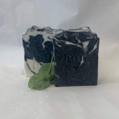 Two bars of soap with 'The I Am Project' branding on a white background