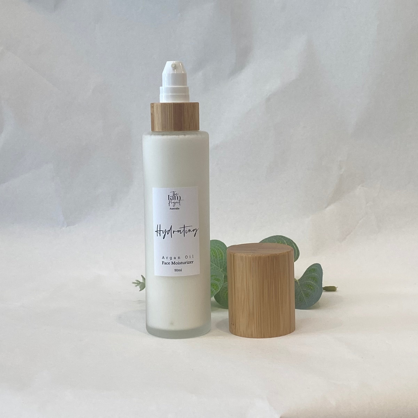 Skincare bottle with wooden cap on a white background