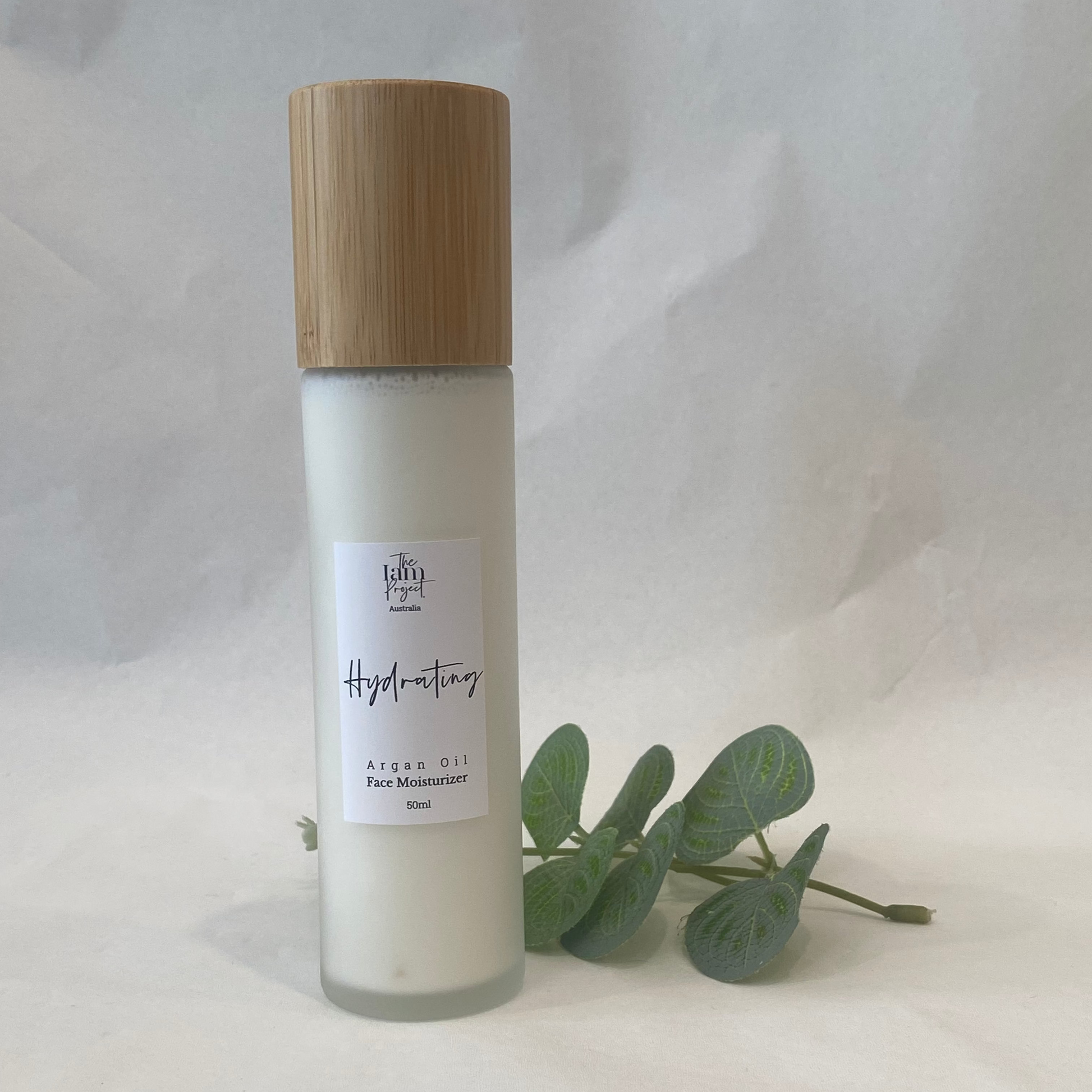 Skincare bottle with a wooden cap on a white background