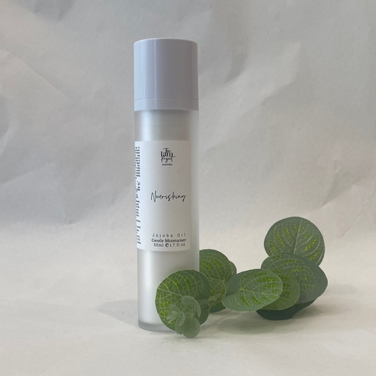 Skincare bottle with a white label on a light gray background