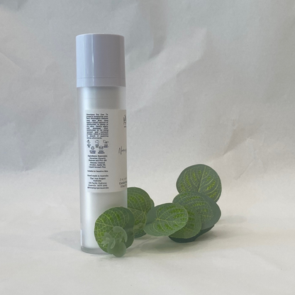 Skincare bottle with eucalyptus leaves on a white background