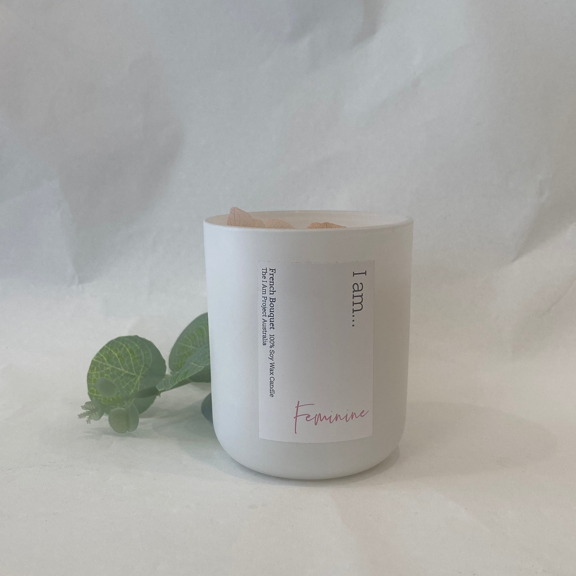 White candle with a label on a white background