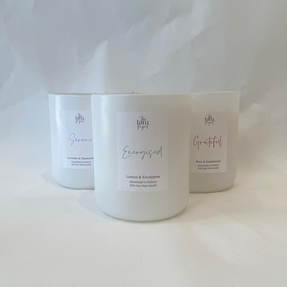 Three candles with labels on a white background